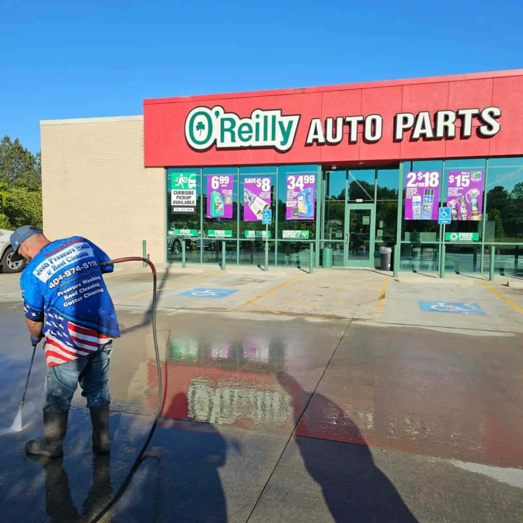 Gainesville, GA: Commercial Pressure Washing Company cleaning concrete at a storefront