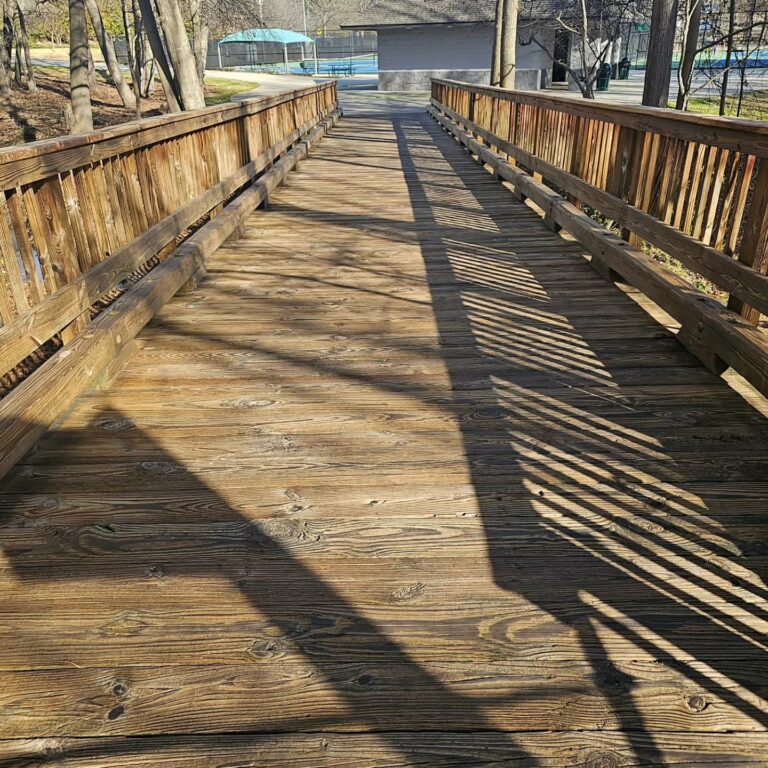 Deck cleaning and wood restoration on a bridge for mildew and mold at Wills Park in Alpharetta, Georgia